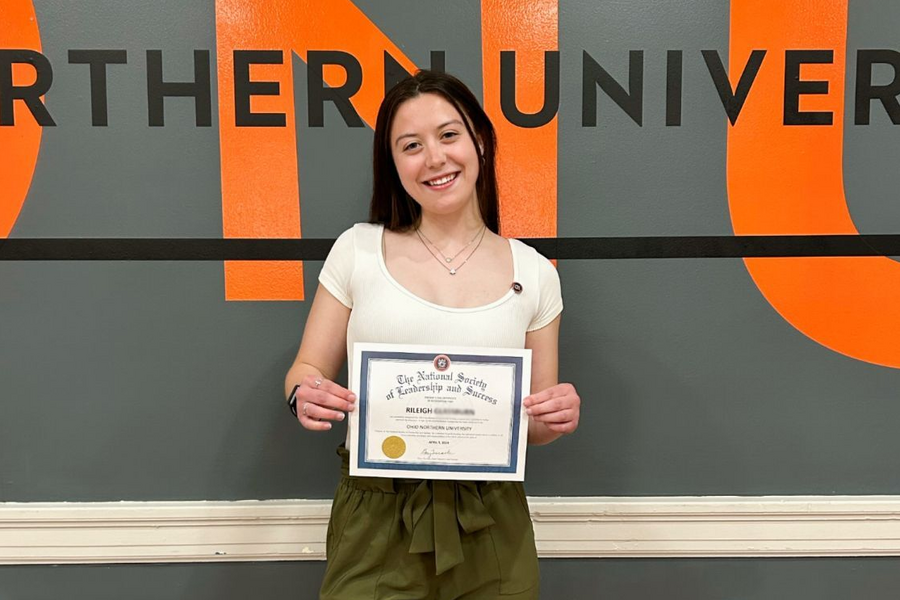 An NSLS member celebrating their induction